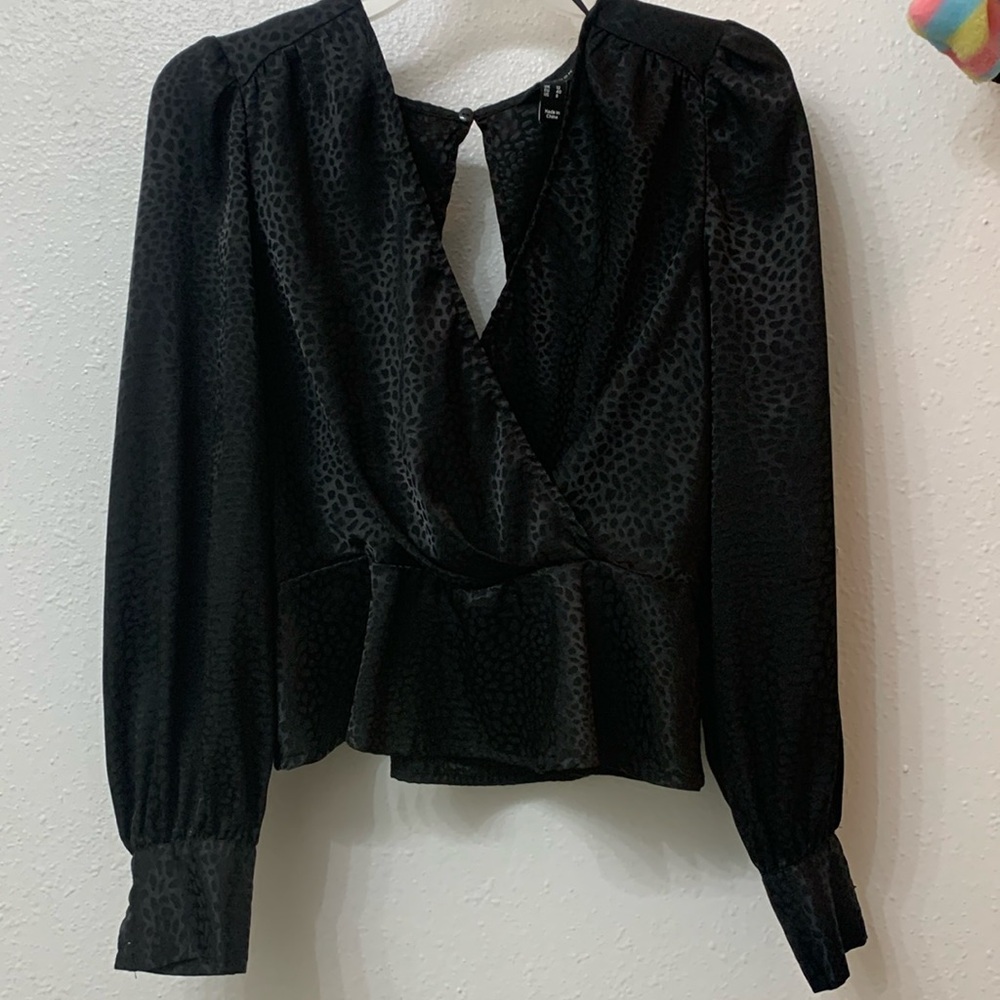 Black leopard print peplum open back blouse